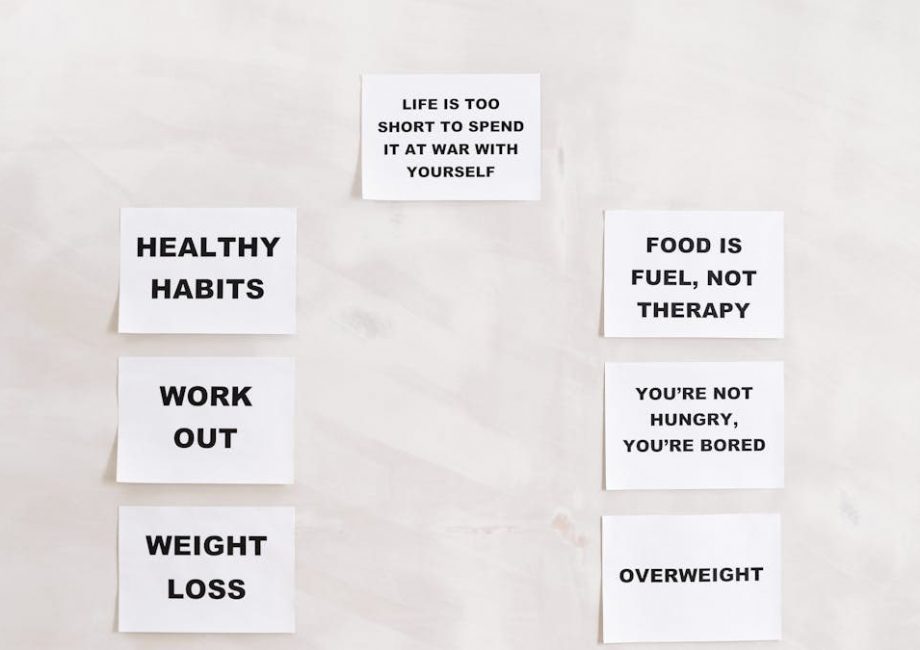 Minimalist display of motivational health and wellness quotes emphasizing healthy habits and weight management.
